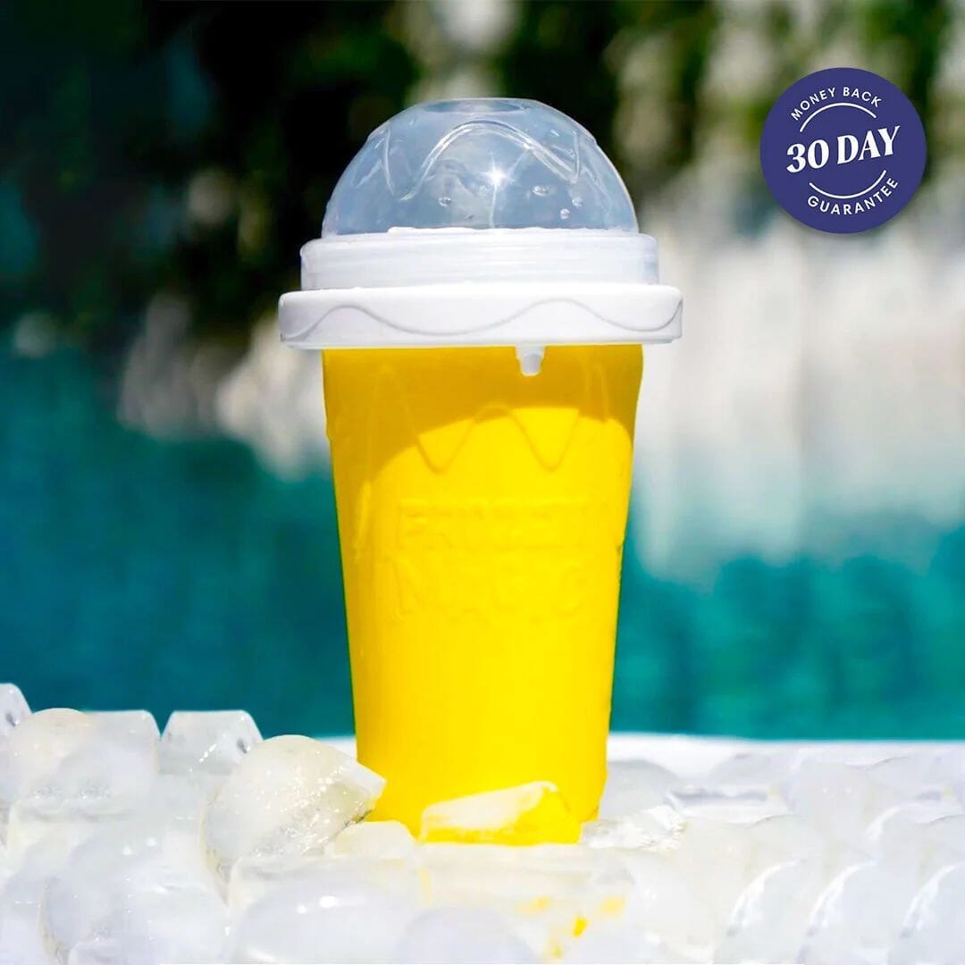 Yellow Slushy Cup filled with juice, a reusable slushie maker also sold in blue, green and pink