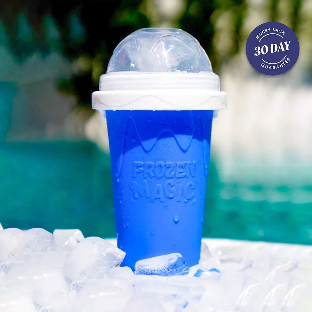 Blue Slushy Cup squeeze maker with its domed lid, resting on ice cubes