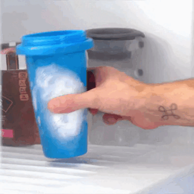 Squeezing the blue Slushy Cup to turn a drink into slush with no blender or ice