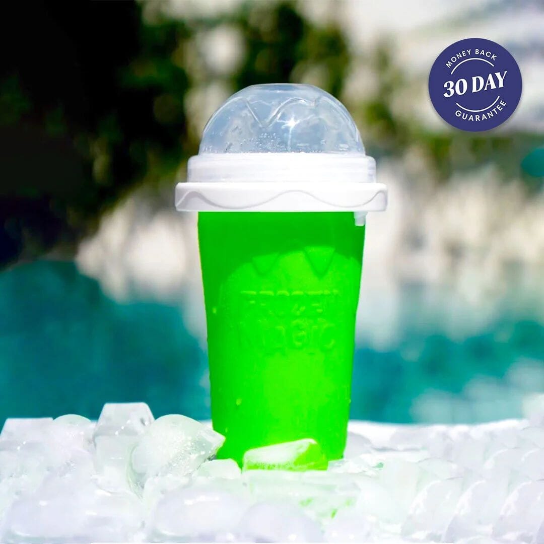 Green Slushy Cup squeeze maker with domed lid and straw, resting on ice