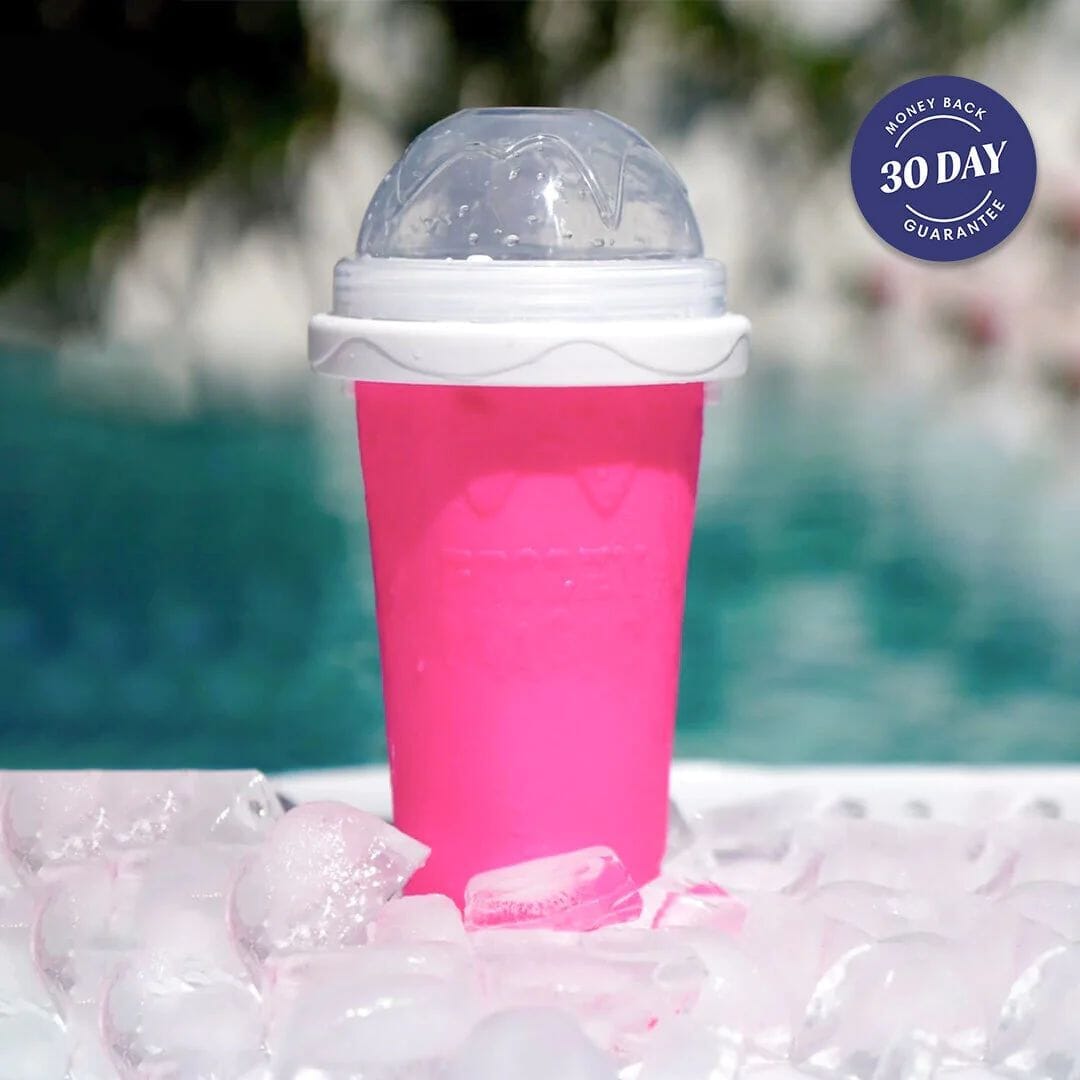 Pink Slushy Cup making a fruit juice slushie, resting on a bed of ice