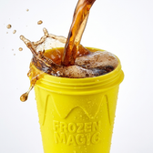 Pouring soda into the yellow Slushy Cup, which also works with juice, lemonade, energy drinks and cocktails